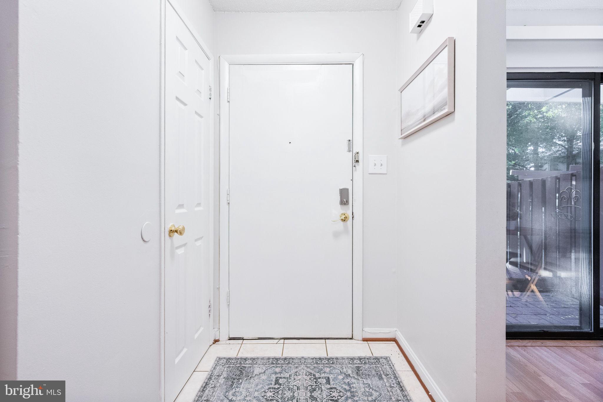 2340 Southgate Square Reston, VA 20191 - Photo 18 of 33 a view of front door with wooden floor
