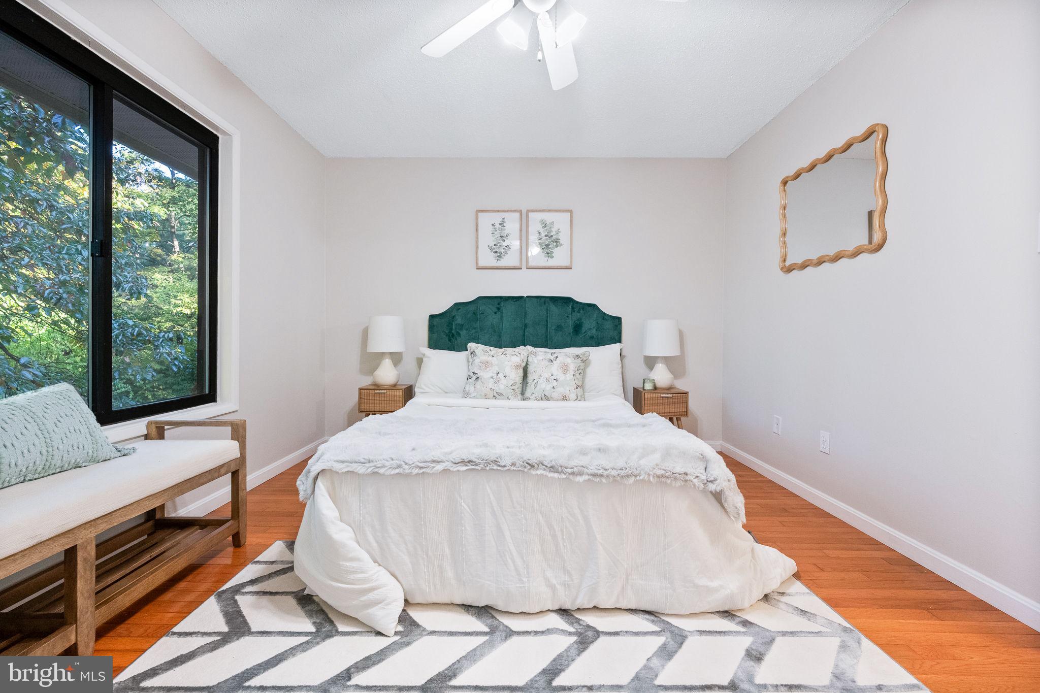 2340 Southgate Square Reston, VA 20191 - Photo 21 of 33 a bedroom with a bed and wooden floor