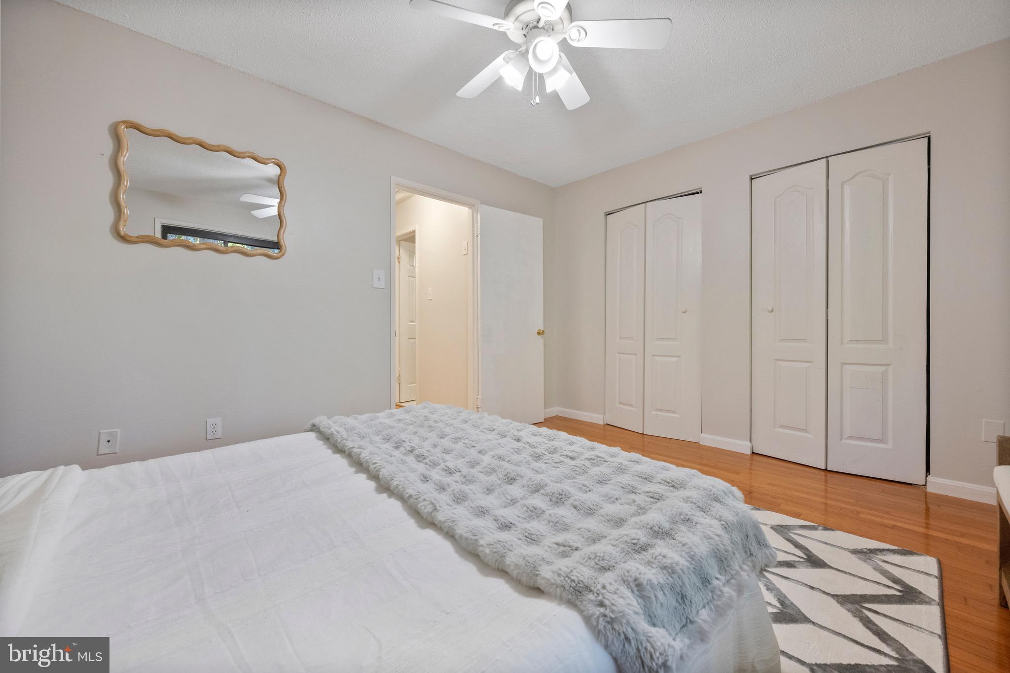 2340 Southgate Square Reston, VA 20191 - Photo 22 of 33 a bedroom with a large bed and a chandelier