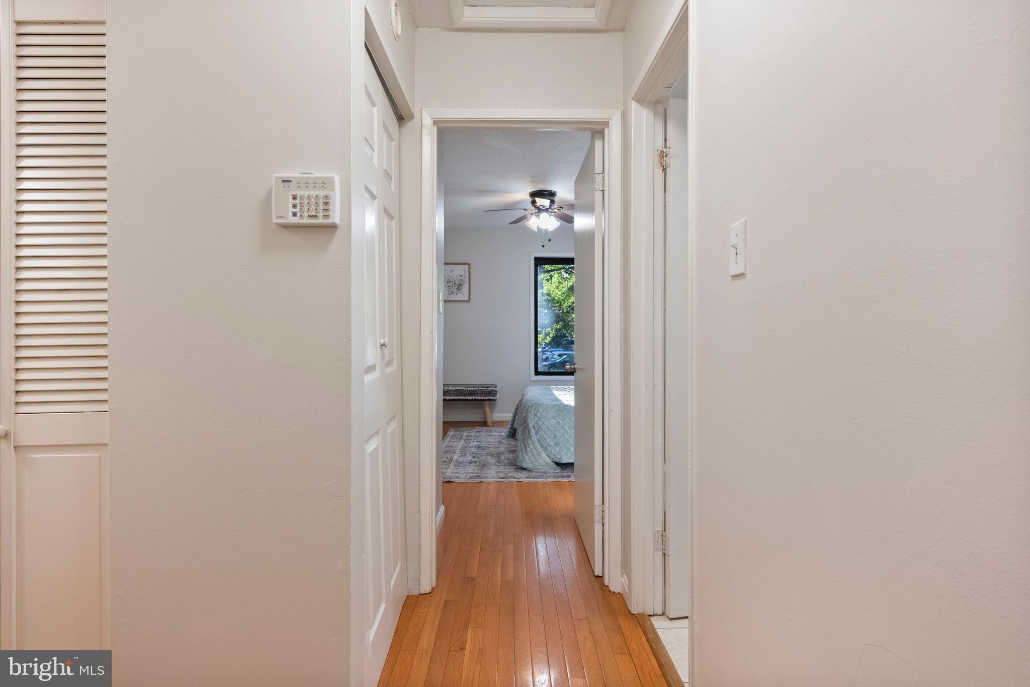 2340 Southgate Square Reston, VA 20191 - Photo 23 of 33 a view of a hallway with wooden floor and a bathroom