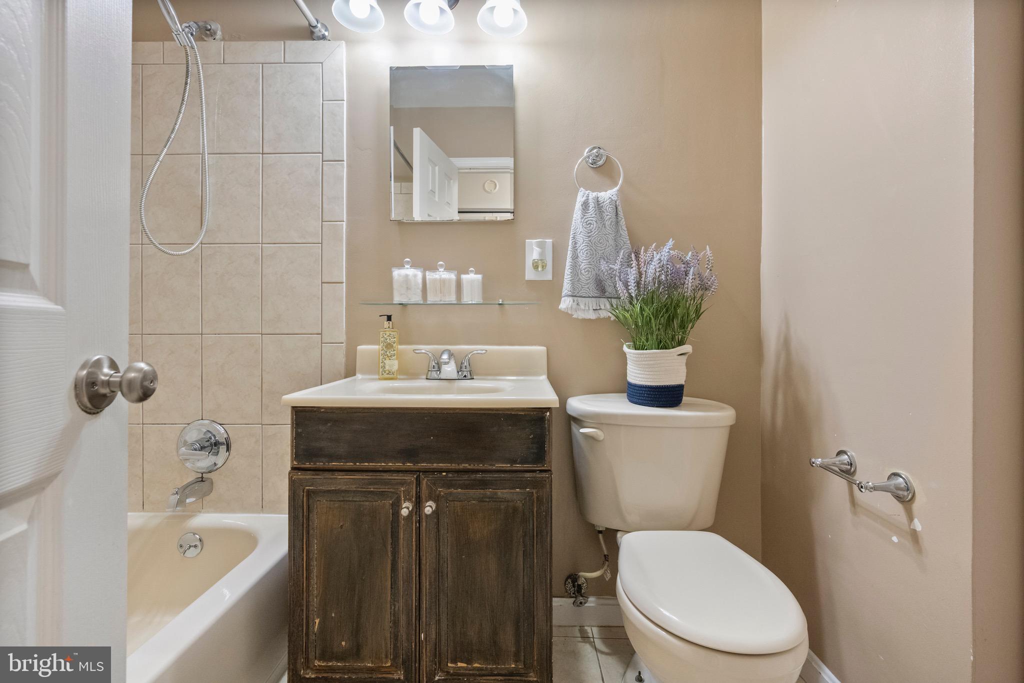 2340 Southgate Square Reston, VA 20191 - Photo 26 of 33 a bathroom with a sink a toilet and shower