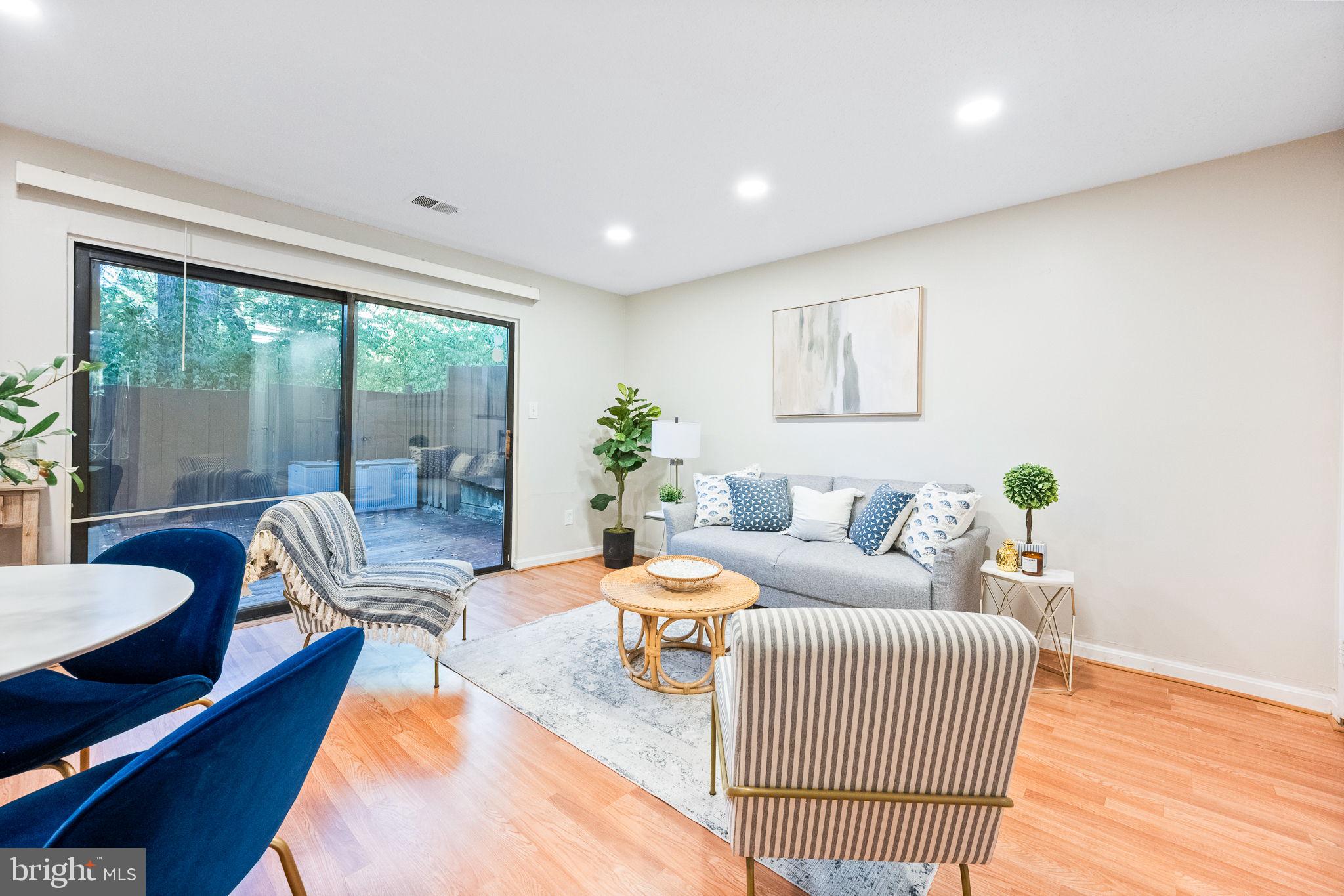 2340 Southgate Square Reston, VA 20191 - Photo 5 of 33 a living room with furniture and a large window