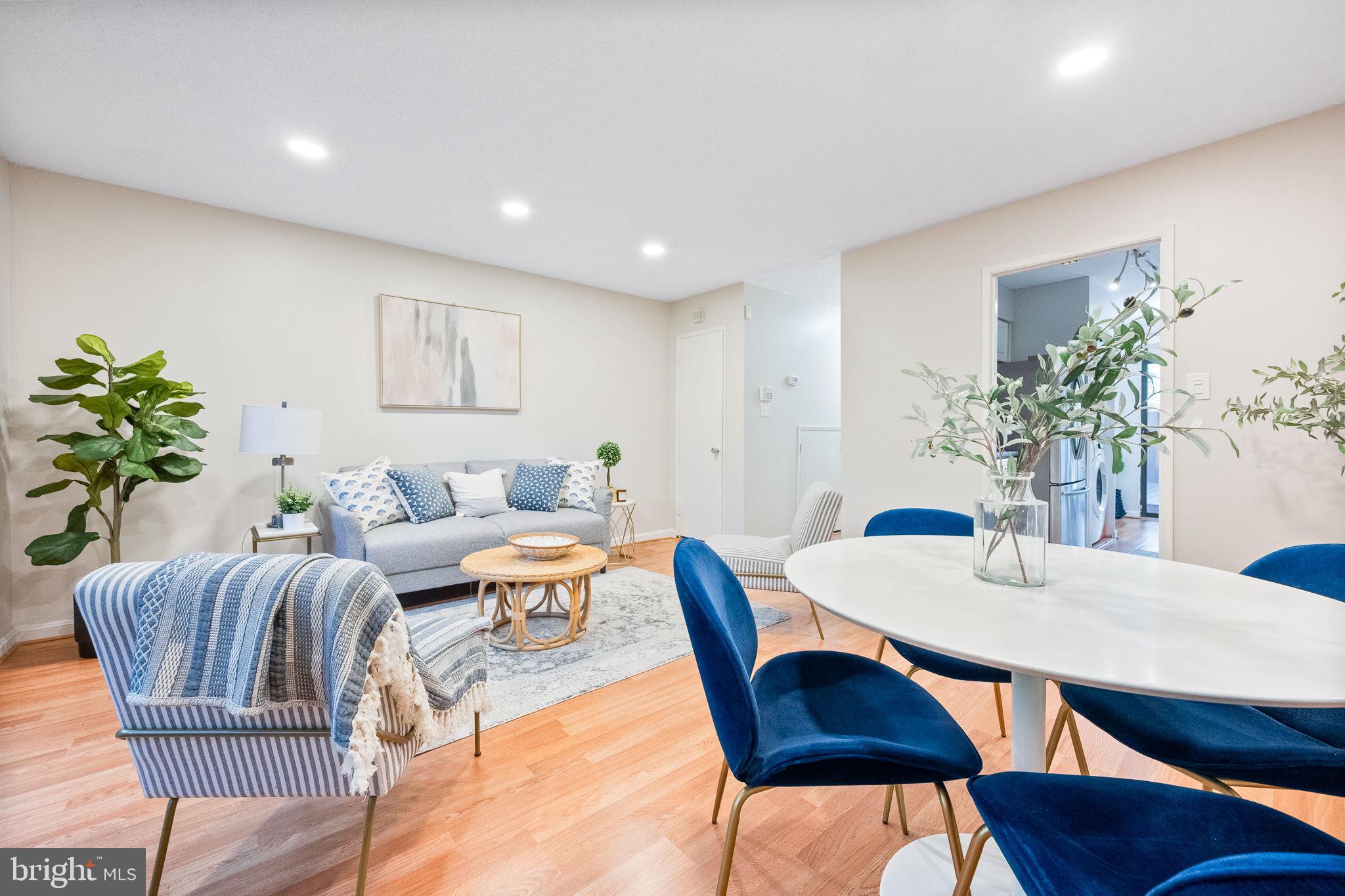 2340 Southgate Square Reston, VA 20191 - Photo 7 of 33 a living room with furniture a potted plant and a table