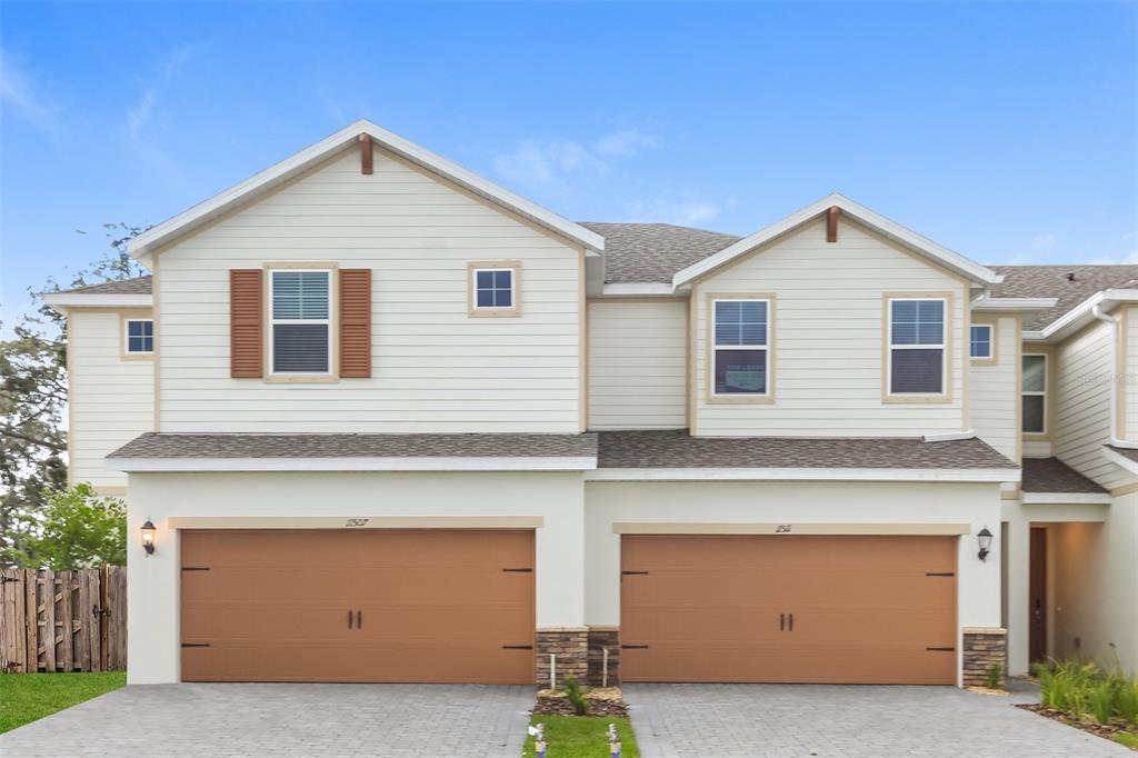 a front view of a house with a garage