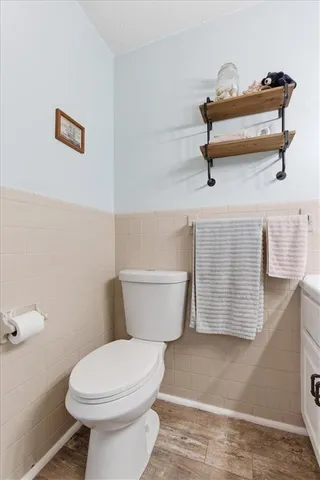a bathroom with a toilet and a sink