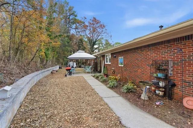 a front view of a house with garden