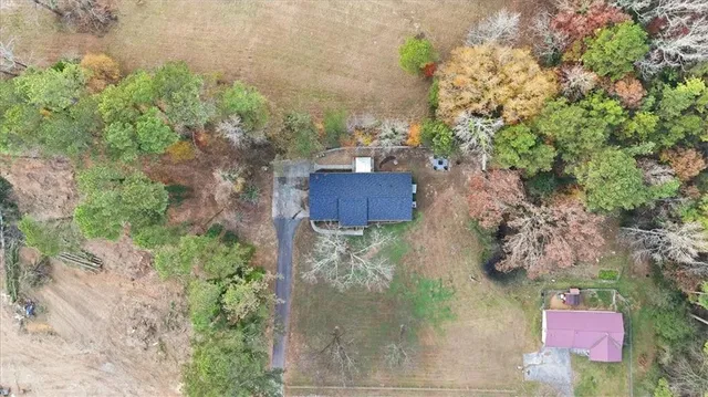 an aerial view of a house with outdoor space
