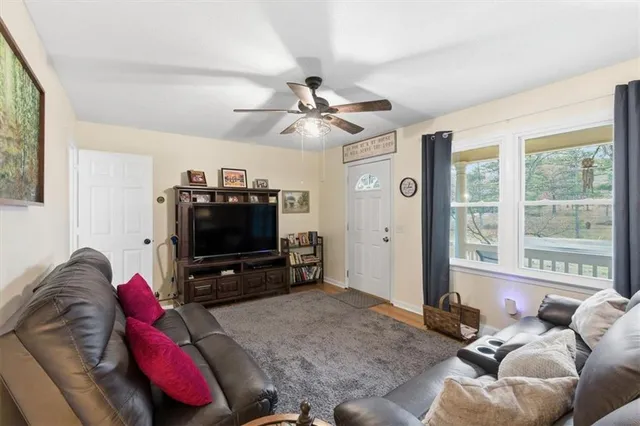a living room with furniture and a flat screen tv