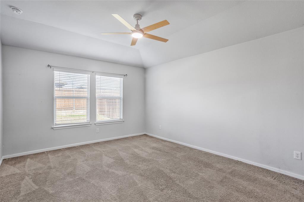424 Amory Street Azle, TX 76020 - Photo 13 of 27 an empty room with ceiling fan and window