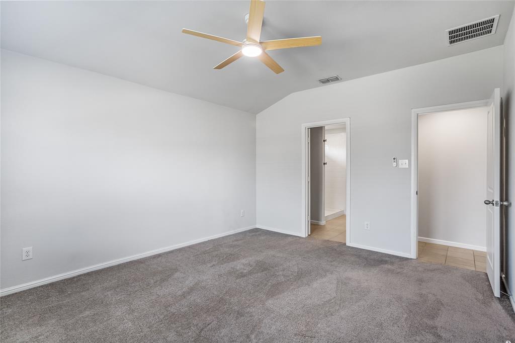 424 Amory Street Azle, TX 76020 - Photo 14 of 27 an empty room with closet and fan
