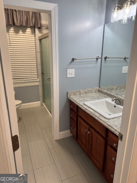 430 Bethany Road Covington, GA 30016 - Photo 15 of 39 a bathroom with a granite countertop sink and a mirror