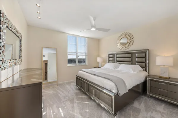 a bedroom with a bed and window