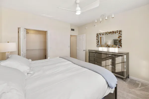 a bedroom with a bed and a table in it