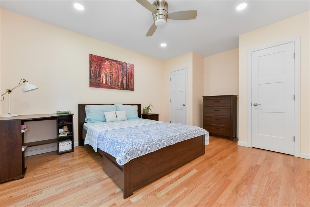 10 Farrow Street Winchester, MA 01890 - Photo 14 of 33 a bedroom with a bed and a dresser