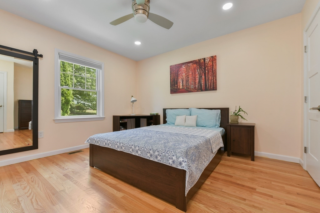 10 Farrow Street Winchester, MA 01890 - Photo 15 of 33 a spacious bedroom with a bed and a window