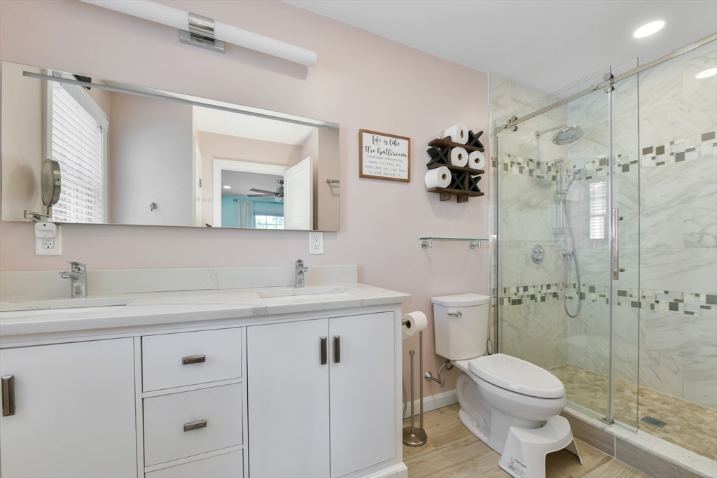 10 Farrow Street Winchester, MA 01890 - Photo 18 of 33 a bathroom with a sink toilet and shower