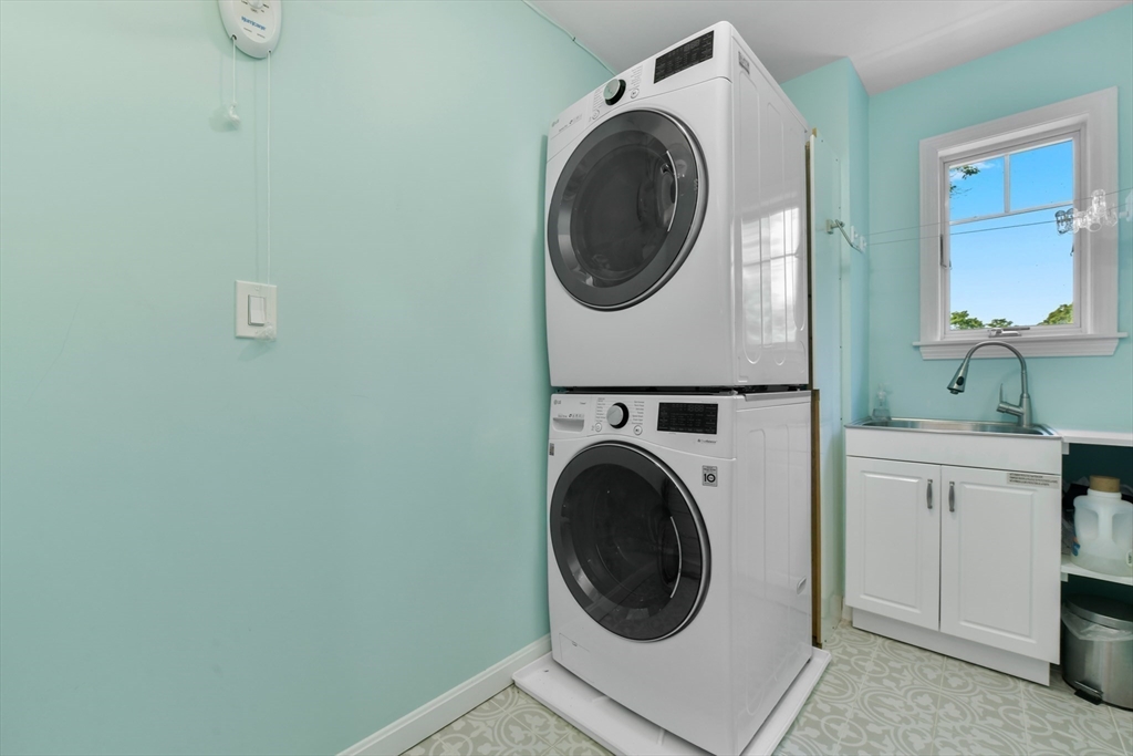 10 Farrow Street Winchester, MA 01890 - Photo 19 of 33 a utility room with sink dryer and washer