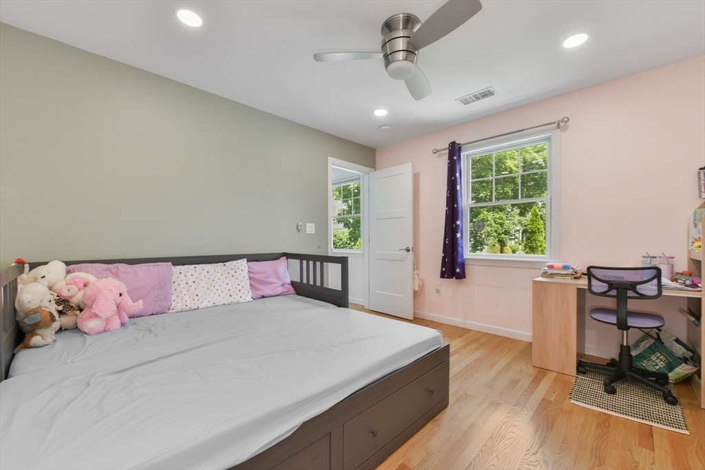 10 Farrow Street Winchester, MA 01890 - Photo 20 of 33 a bedroom with a bed and a table