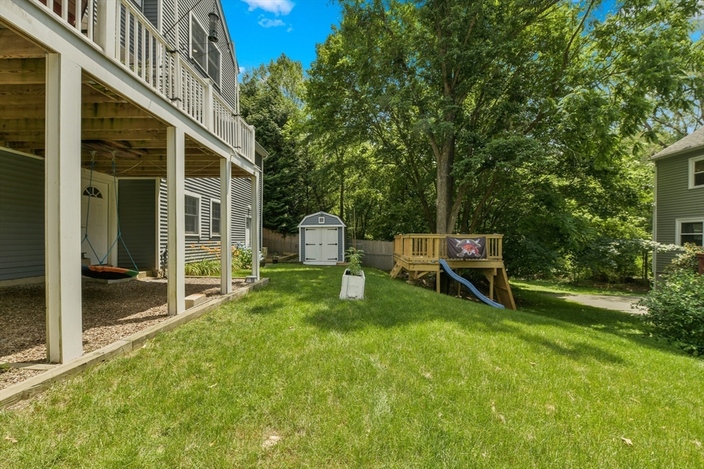 10 Farrow Street Winchester, MA 01890 - Photo 32 of 33 a backyard of a house with table and chairs