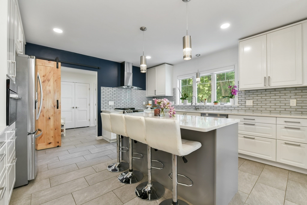 10 Farrow Street Winchester, MA 01890 - Photo 4 of 33 a kitchen with a sink cabinets and window
