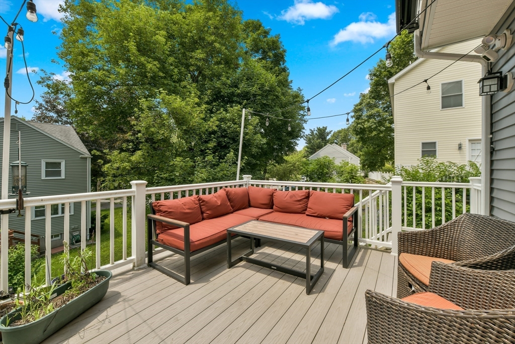 10 Farrow Street Winchester, MA 01890 - Photo 8 of 33 a balcony with wooden floor and outdoor seating