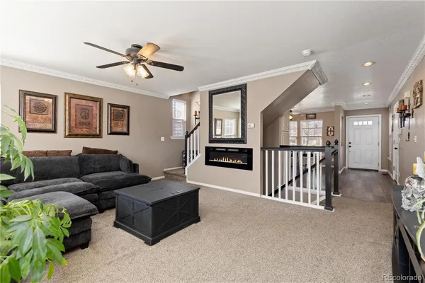 a living room with furniture and windows