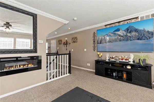 a bedroom with a bed and a fireplace