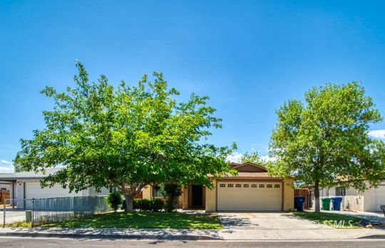 405 South Fountain Street Ridgecrest, CA 93555 - Photo 1 of 24 a house with trees in the background