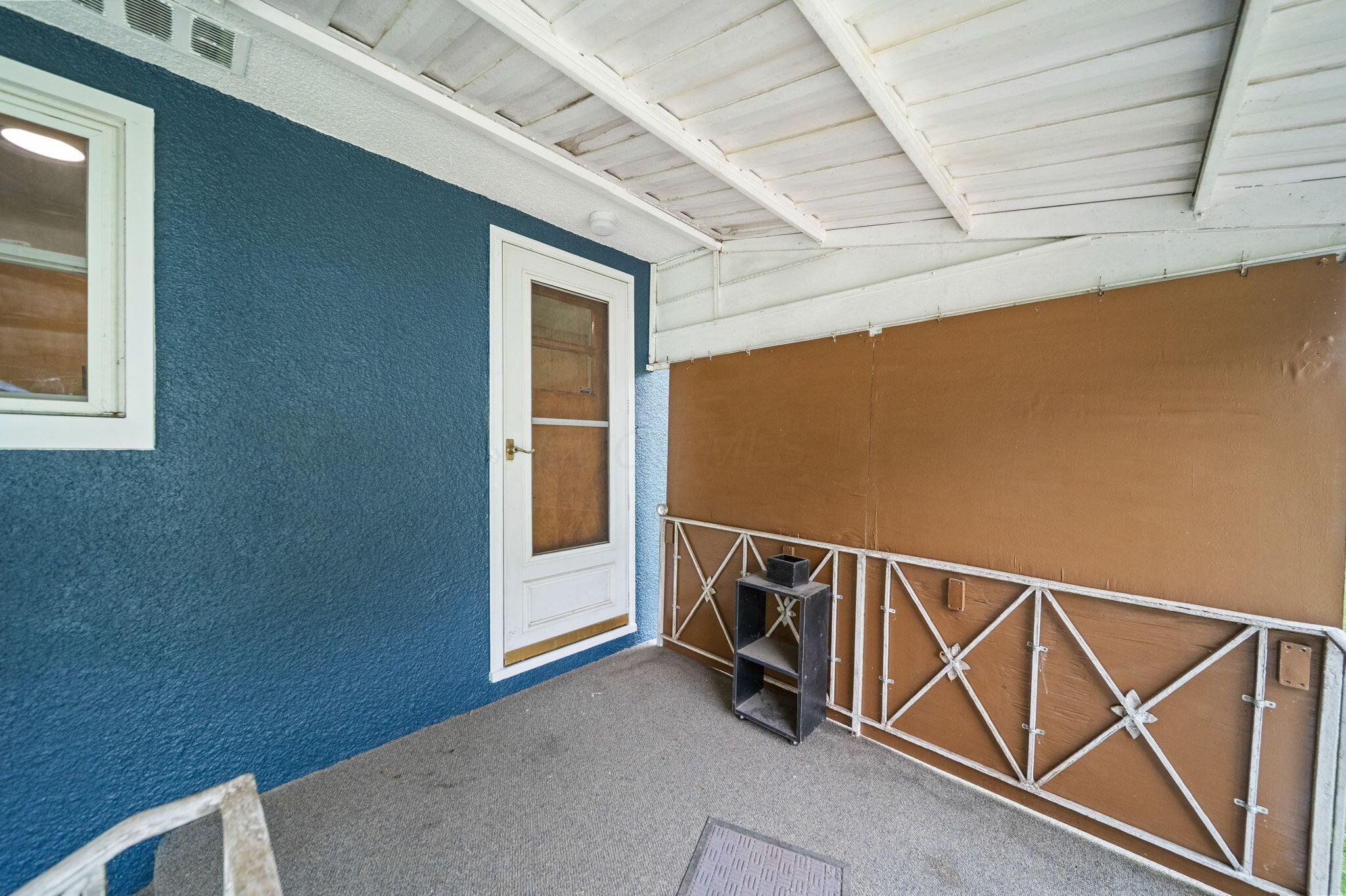 3496 Wicklow Road Columbus, OH 43204 - Photo 37 of 53 Covered patio with a painted wood ceiling, stucco exterior wall, and metal railing
