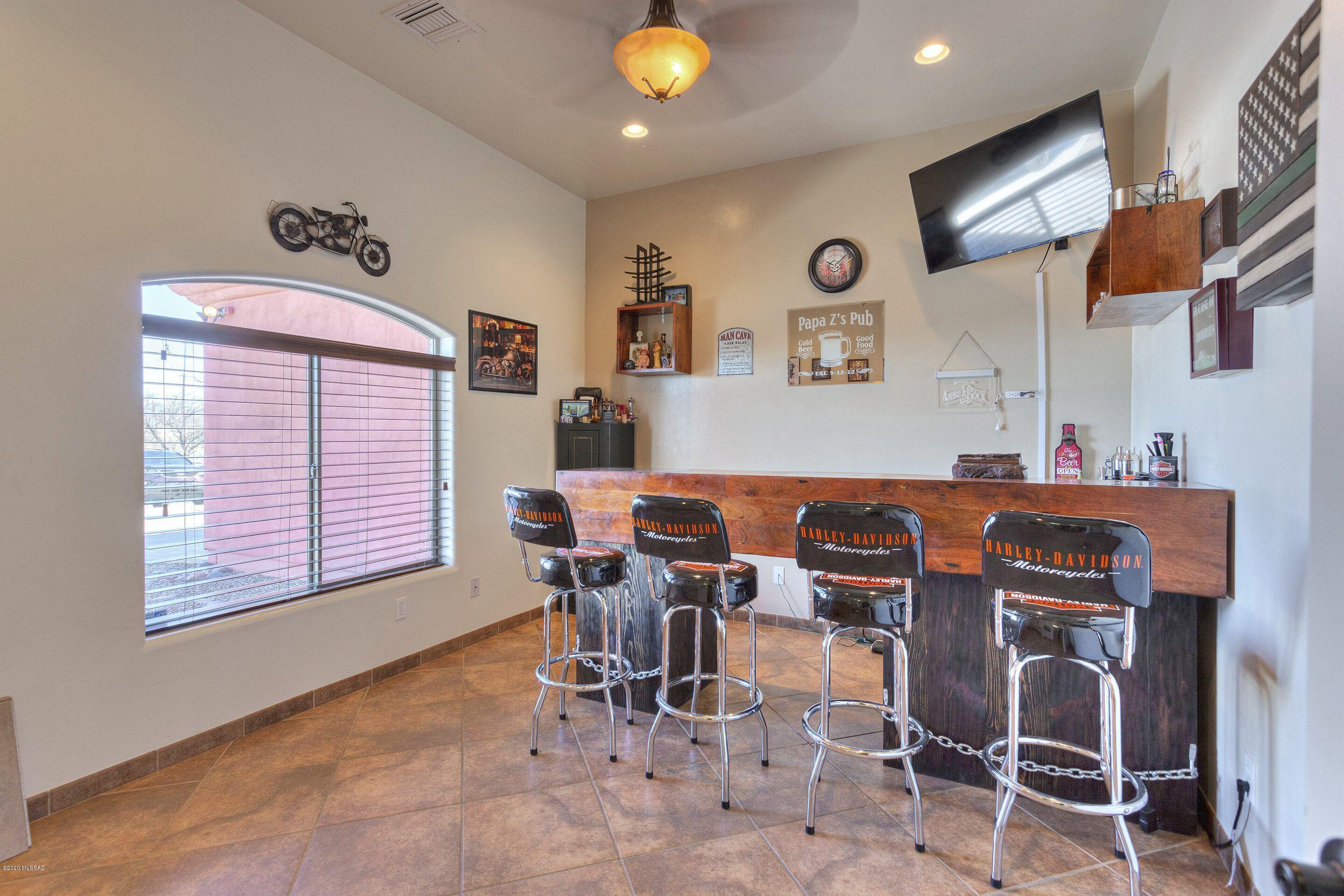 928 Paseo Cieneguita Rio Rico, AZ 85648 - Photo 11 of 27 a view of a dining room with furniture and chandelier