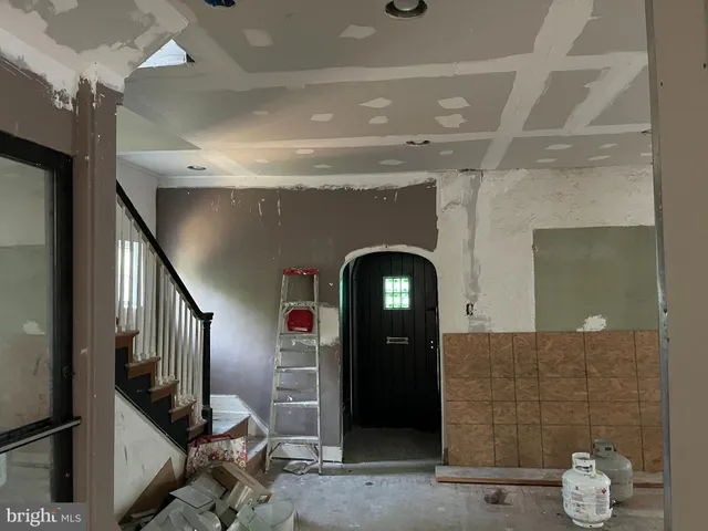 a dining room with furniture and gym equipment