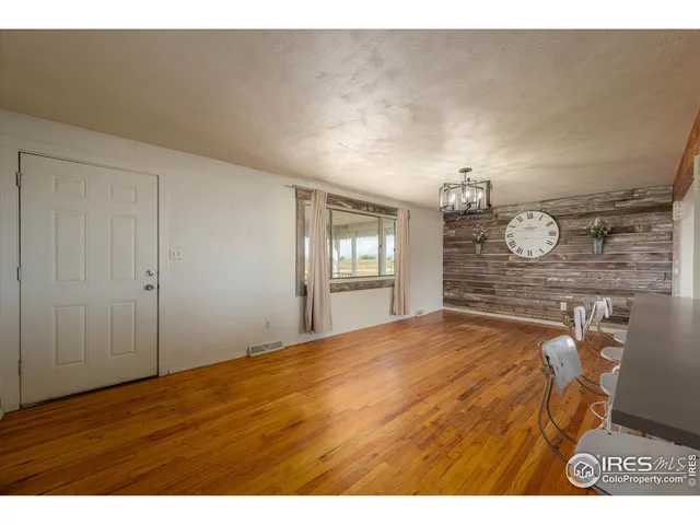 a view of a livingroom with wooden floor