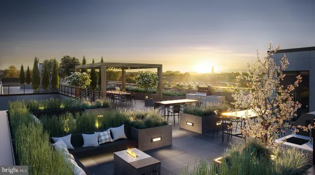 a terrace with outdoor seating and city view