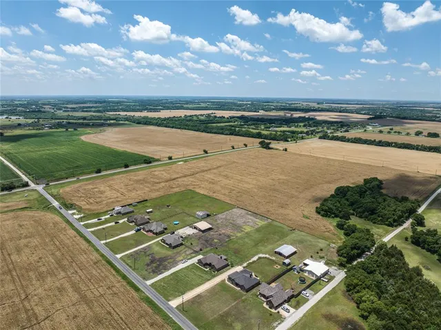 an aerial view of beach and yard