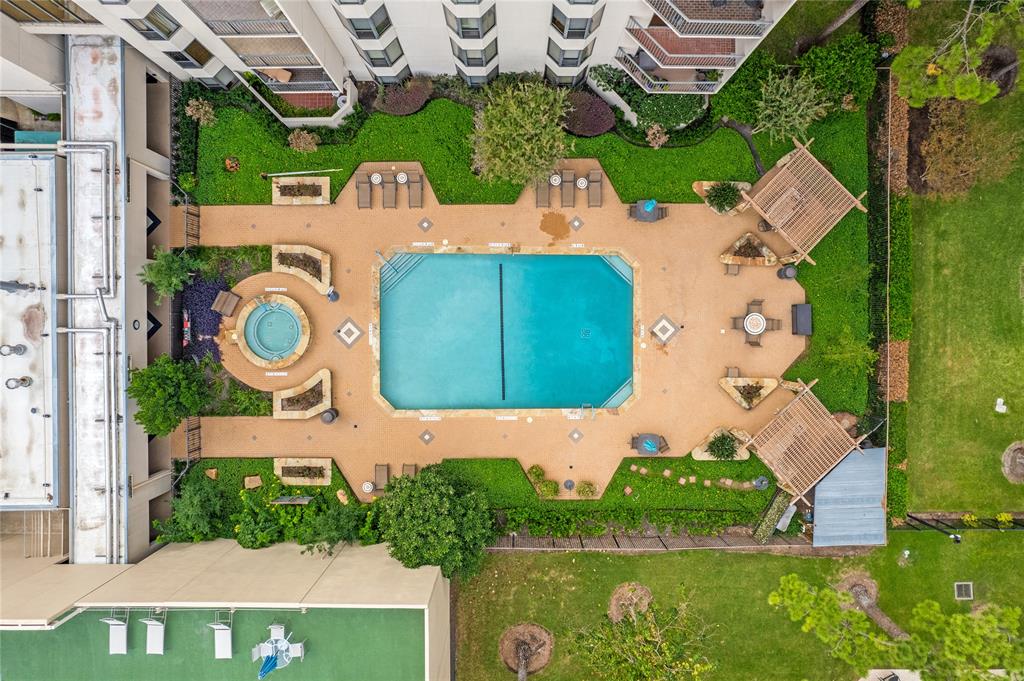 an aerial view of a house with garden space pool outdoor seating