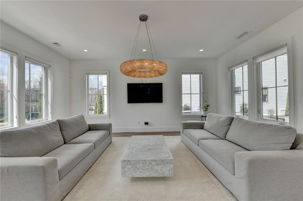 6785 Halcyon Way Alpharetta, GA 30005 - Photo 16 of 90 a living room with furniture and a large window
