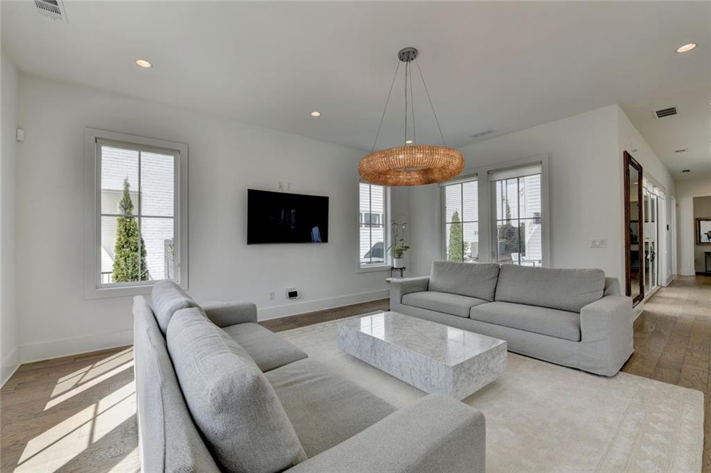 6785 Halcyon Way Alpharetta, GA 30005 - Photo 18 of 90 a living room with furniture and a flat screen tv