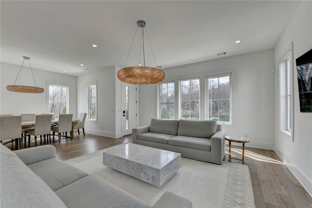 6785 Halcyon Way Alpharetta, GA 30005 - Photo 21 of 90 a living room with furniture and a large window