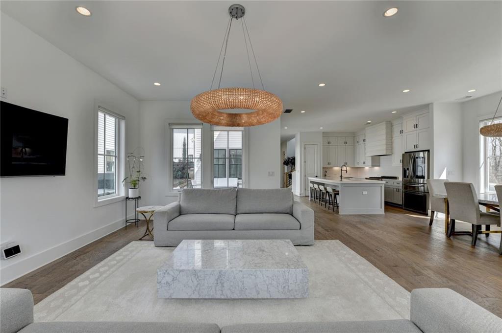 6785 Halcyon Way Alpharetta, GA 30005 - Photo 22 of 90 a living room with furniture and a flat screen tv