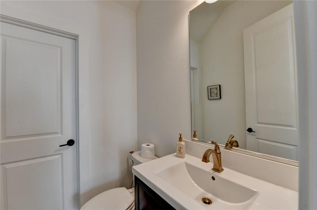6785 Halcyon Way Alpharetta, GA 30005 - Photo 40 of 90 a bathroom with a sink and a toilet