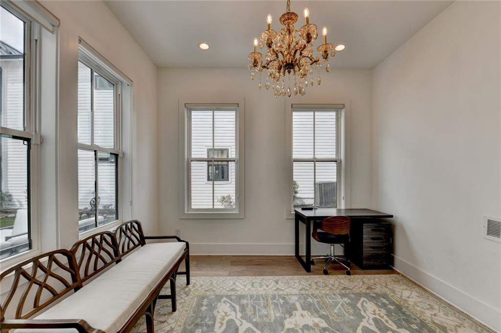 6785 Halcyon Way Alpharetta, GA 30005 - Photo 51 of 90 a living room with furniture and a chandelier