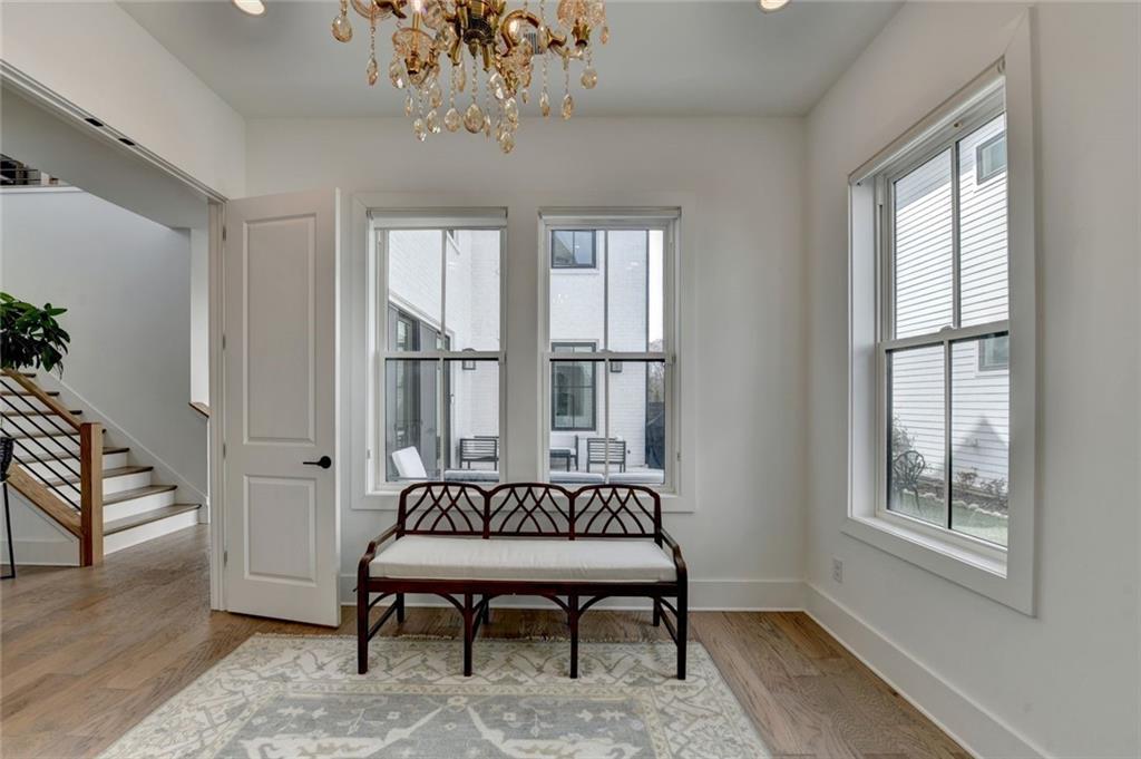 6785 Halcyon Way Alpharetta, GA 30005 - Photo 53 of 90 a view of a livingroom with furniture window and wooden floor