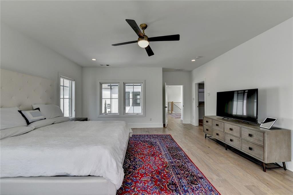 6785 Halcyon Way Alpharetta, GA 30005 - Photo 59 of 90 a living room with furniture and a flat screen tv