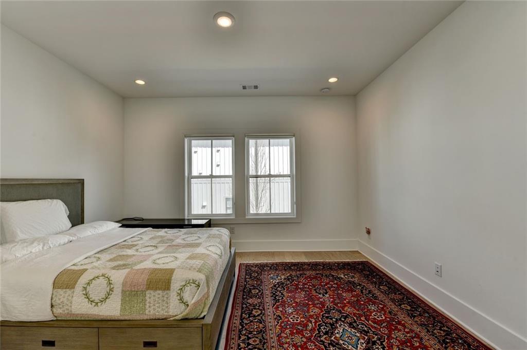 6785 Halcyon Way Alpharetta, GA 30005 - Photo 71 of 90 a large bedroom with a bed and a window