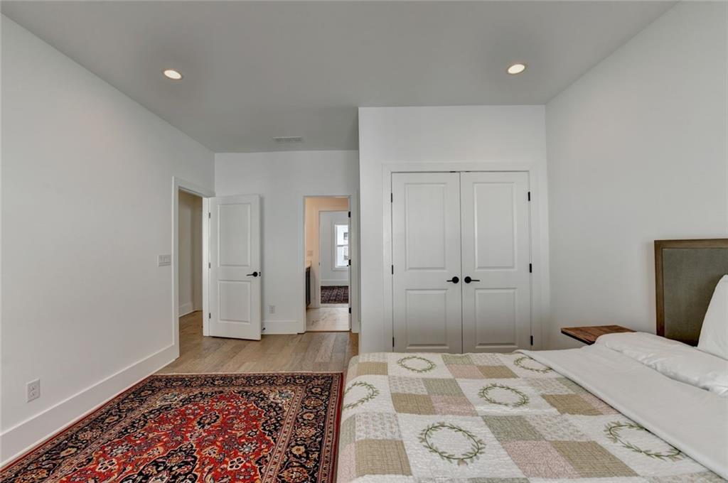 6785 Halcyon Way Alpharetta, GA 30005 - Photo 74 of 90 a bedroom with a bed and a rug