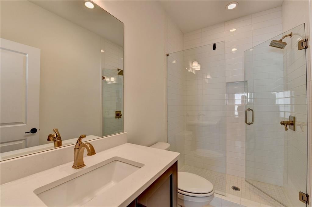 6785 Halcyon Way Alpharetta, GA 30005 - Photo 79 of 90 a bathroom with a sink a toilet and shower