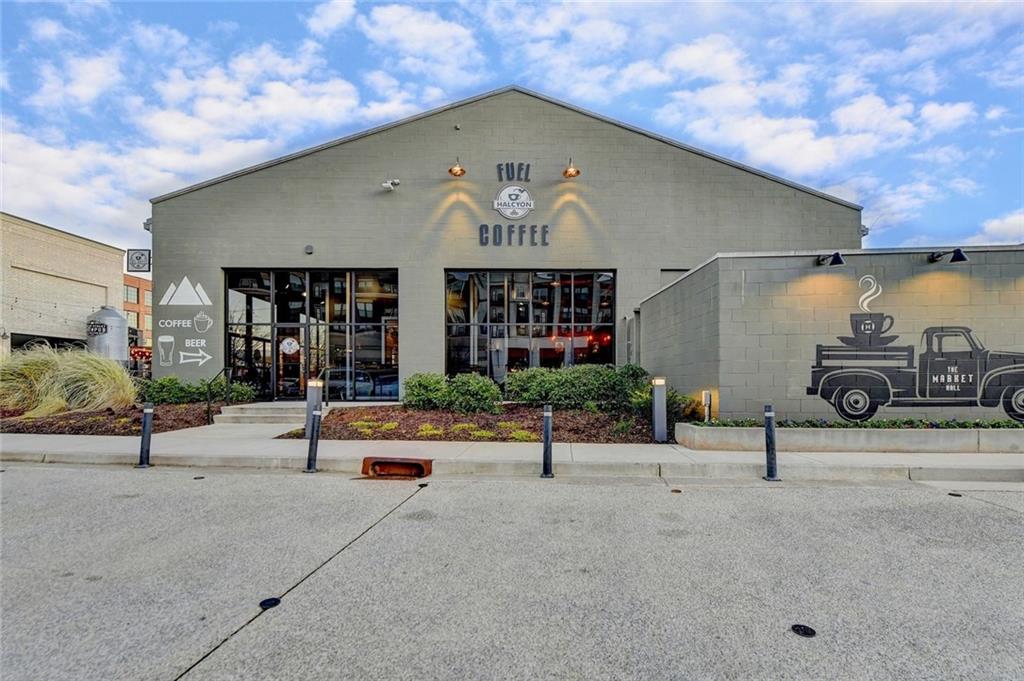 6785 Halcyon Way Alpharetta, GA 30005 - Photo 84 of 90 a view of a patio with table and chairs potted plants and a building
