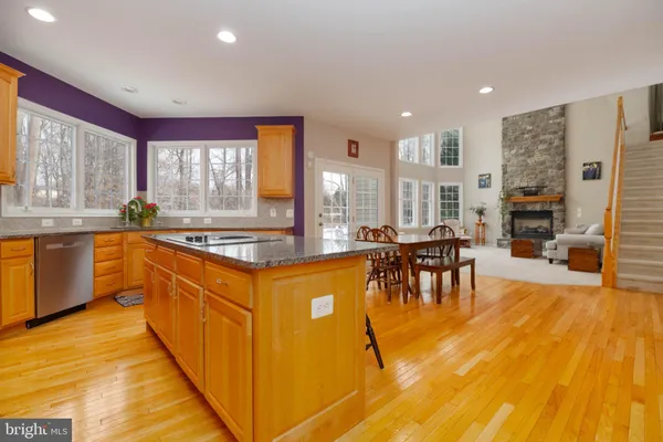 a bathroom with a toilet a sink and a mirror