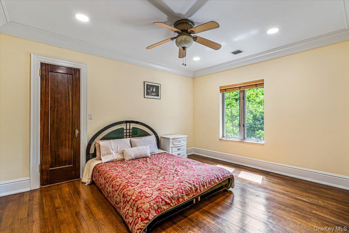 952 Cedar Swamp Road Glen Head, NY 11545 - Photo 27 of 50 a bedroom with a bed and a window