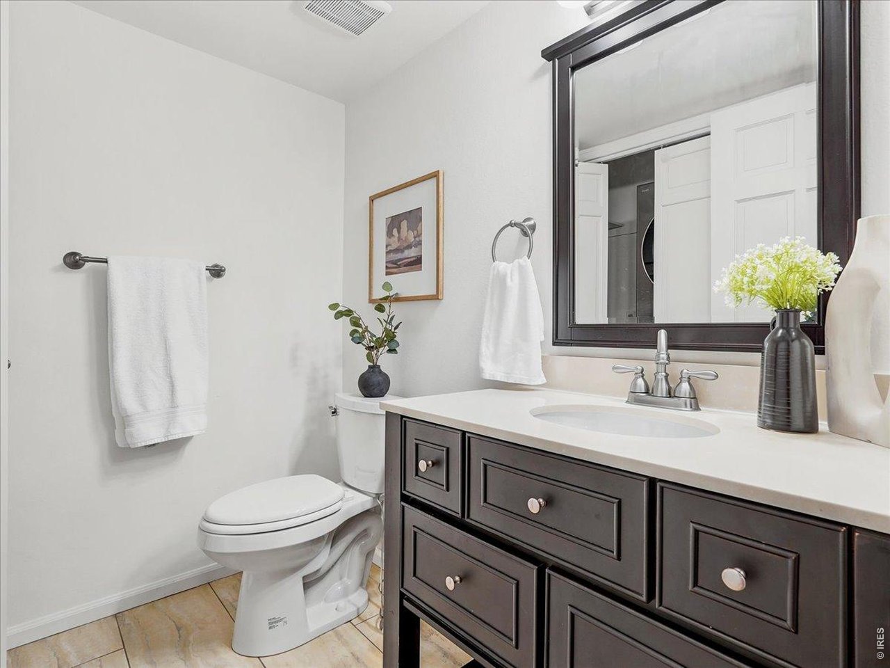 2115 Ranch Drive Denver, CO 80234 - Photo 21 of 50 1/2 bathroom on the main floor with stackable laundry